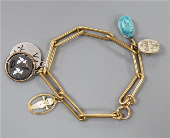 An 18ct bracelet, hung with five assorted charms, gross 33 grams.